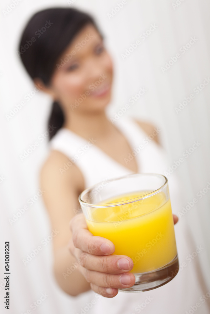 Asian Chinese Girl Holding Glass of Orange Juice to Camera Asian Chinese Girl Holding Glass of Orange Juice to Camera