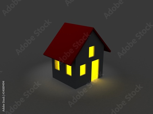 A dark house at night with a windows with a light