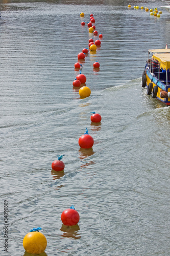 Fotografija The wash from a ferry disturbs buoys in Bristol harbour UK