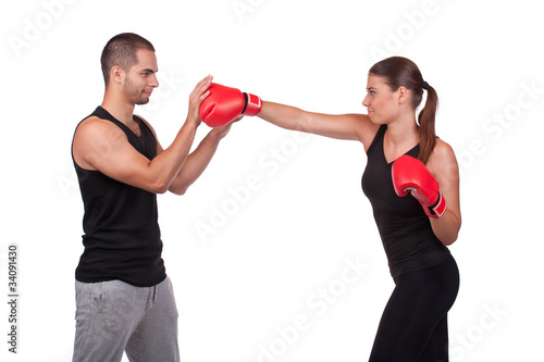 Woman boxer with trainer