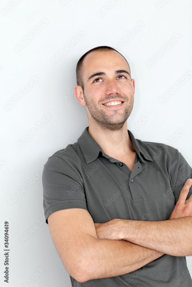 Portrait of smiling man with arms crossed