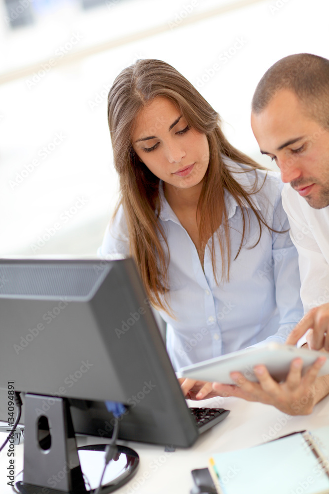 Young adults in training course using touchpad Young adults in training course using touchpad