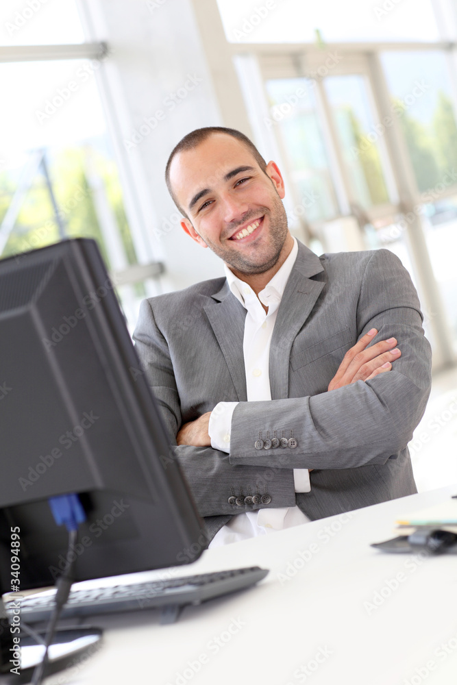 Portrait of satisfied businessman in office Portrait of satisfied businessman in office