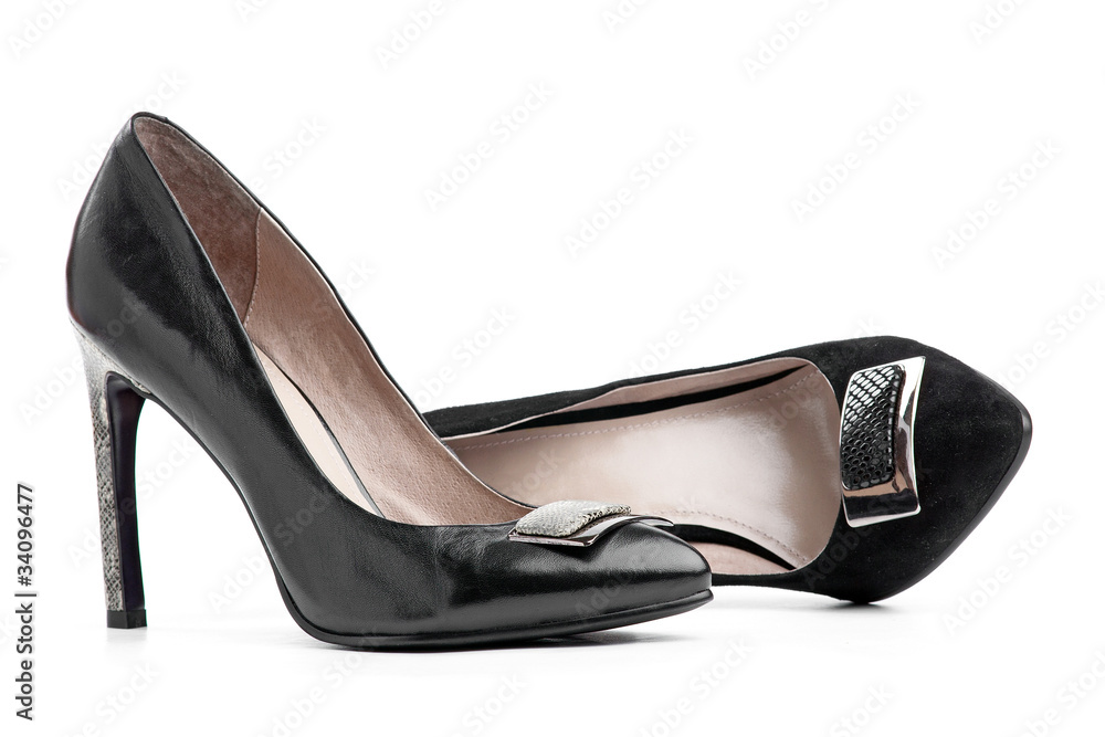 Pair of black female shoes over white Pair of black female shoes over white