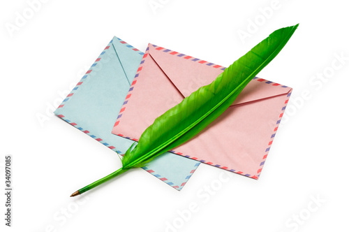 Envelope and feather isolated on the white photo