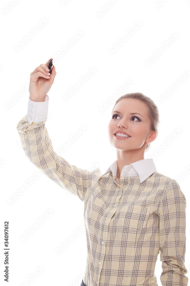Smiling businesswoman writes at the top of the marker in front o Smiling businesswoman writes at the top of the marker in front o