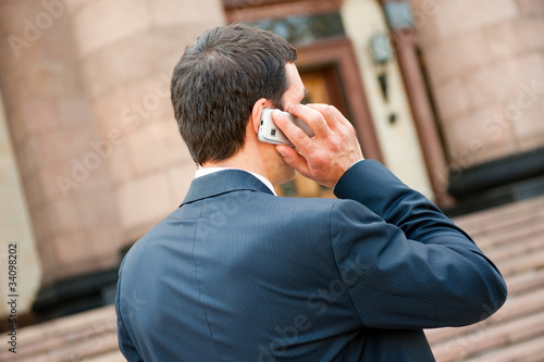 Young businessman calls on mobile © Anton Gvozdikov
