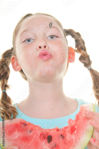 Canvas Print Girl spitting watermelon seed
