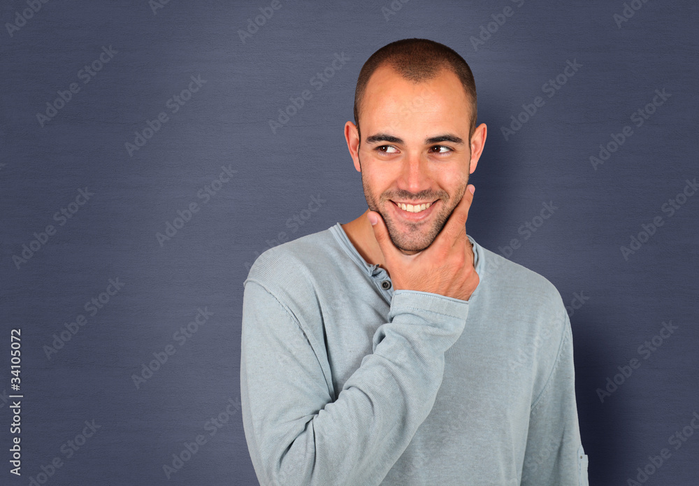 Handsome man standing on blue background Handsome man standing on blue background