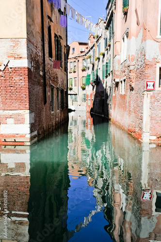 Houses reflected in the water in Venice (Italy) © pmstudio