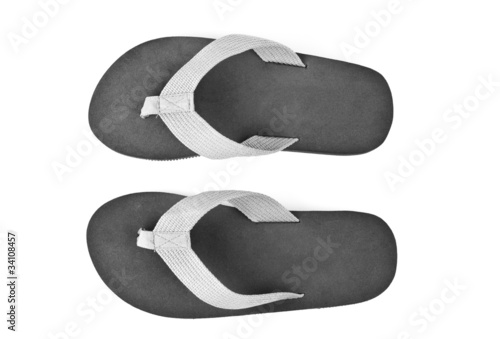 Bild auf Leinwand pair of black flip flops isolated on white background