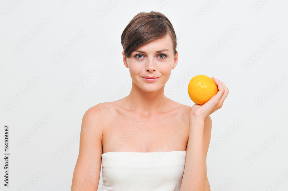 Beautiful woman holding orange in hands Beautiful woman holding orange in hands