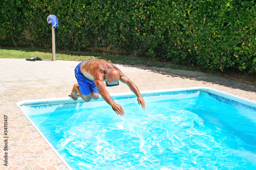 Man jumping to swimming pool