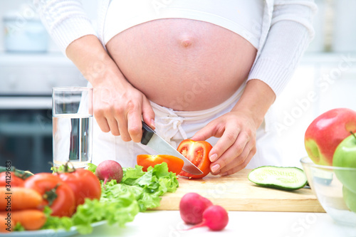 Pregnant woman cooking