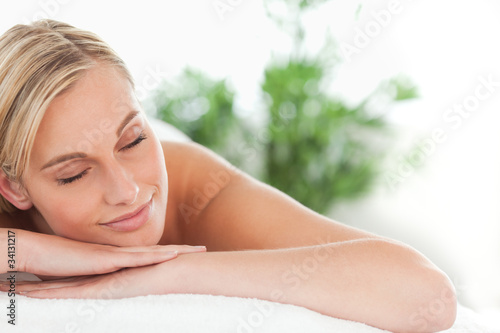 Close up of a woman lying on a lounger having a massage