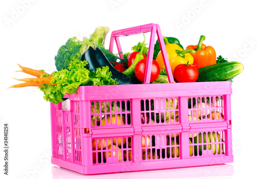 A set of vegetables in plastic basket isolated on white