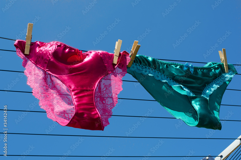 Lesbian concept of silk knickers on washing line Stock Photo