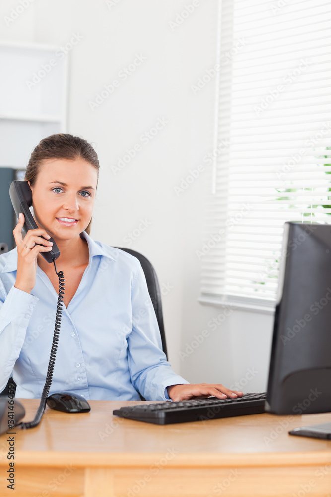 Office worker making a phone call Office worker making a phone call