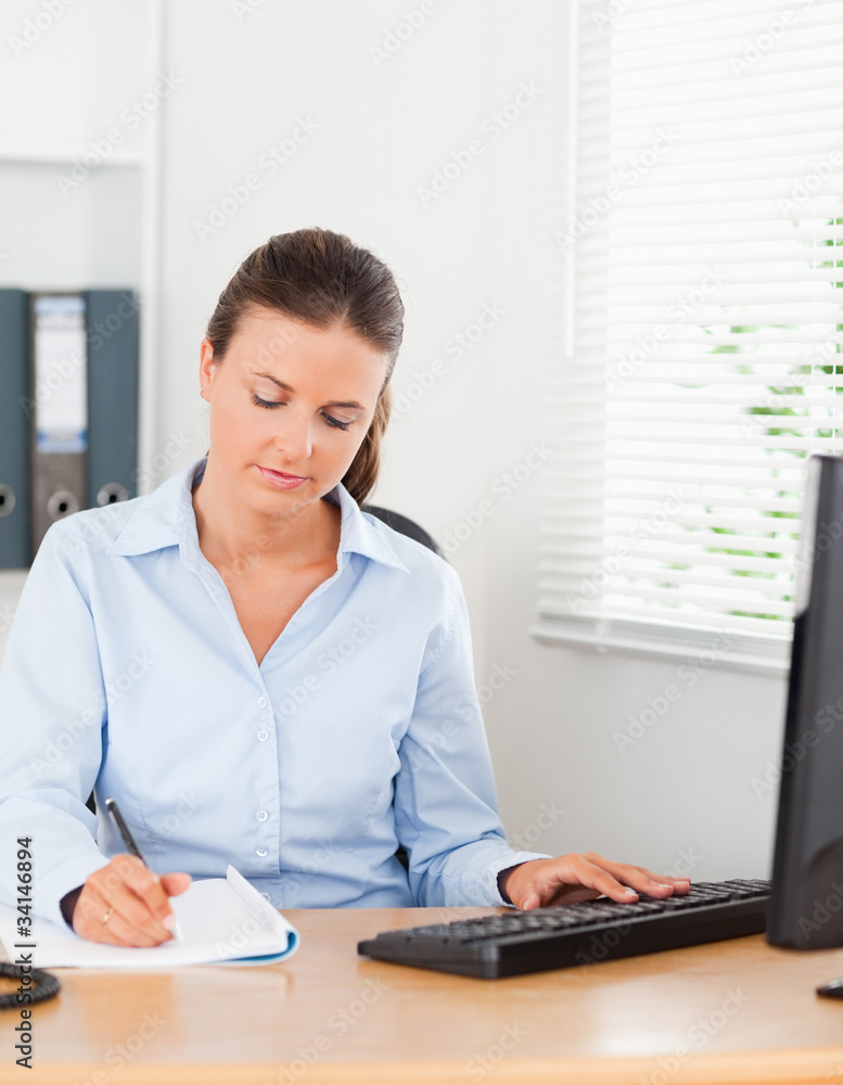 Businesswoman concentrating on a paper