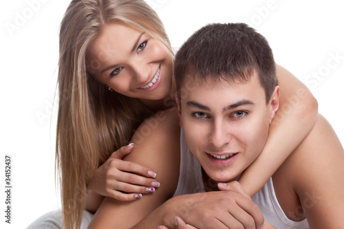 couple lying on white bed