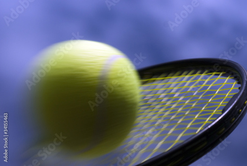 Speedy tennis ball on racket © mema