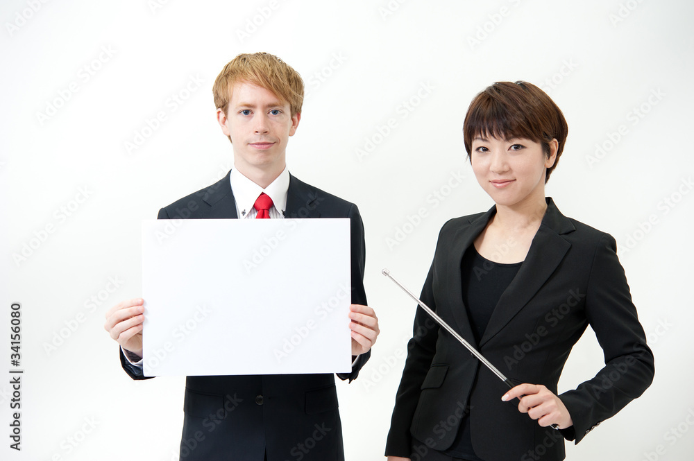 businessteam holding a blank whiteboard businessteam holding a blank whiteboard