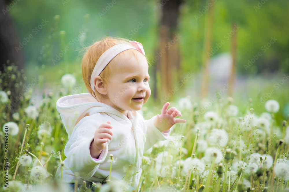Outdoor portrait of a cute little baby in the grass Outdoor portrait of a cute little baby in the grass