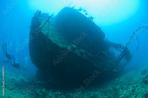 Scuba divers on a large shipwreck © Paul Vinten