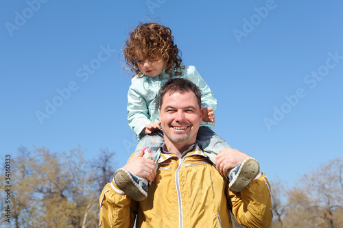 litlle girl with father in the park