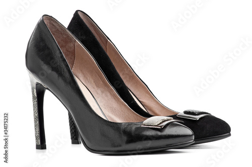 Pair of black female shoes over white