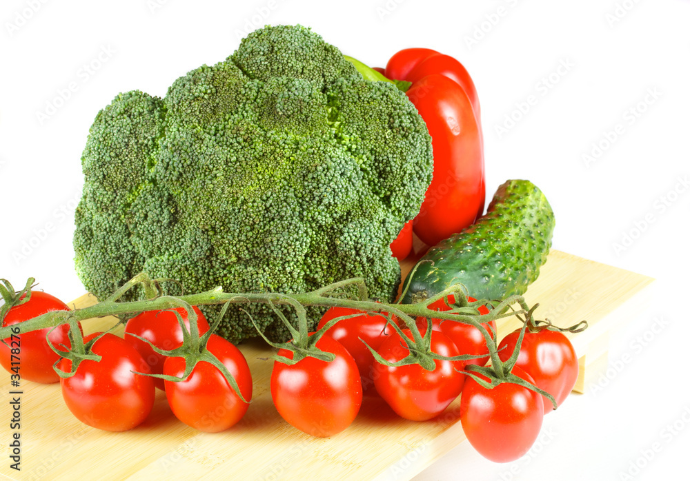 fresh and juicy vegetables on the wood plate isolated fresh and juicy vegetables on the wood plate isolated