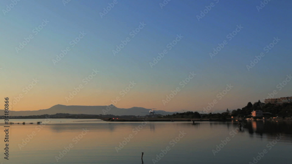 Landing of airplane, sunset scene, Corfu airport, Greece