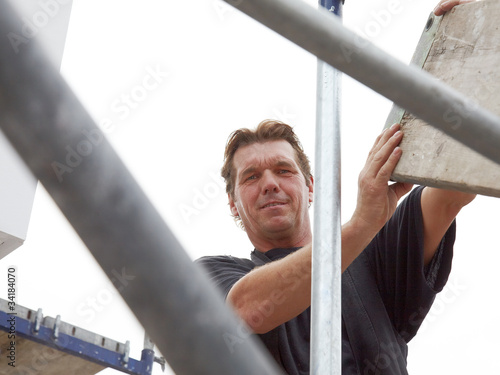 Scaffolder standing on a scaffold outside