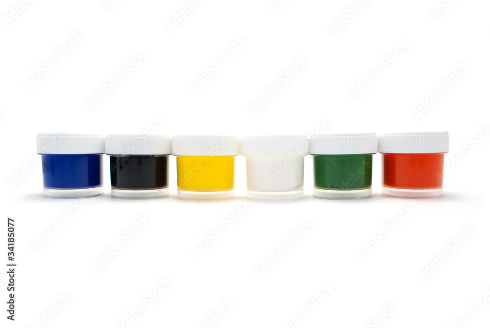 A set of colored paints in transparent plastic containers. A set of colored paints in transparent plastic containers.
