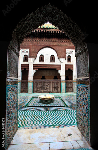 Arch doorway frames courtyard of madrasa