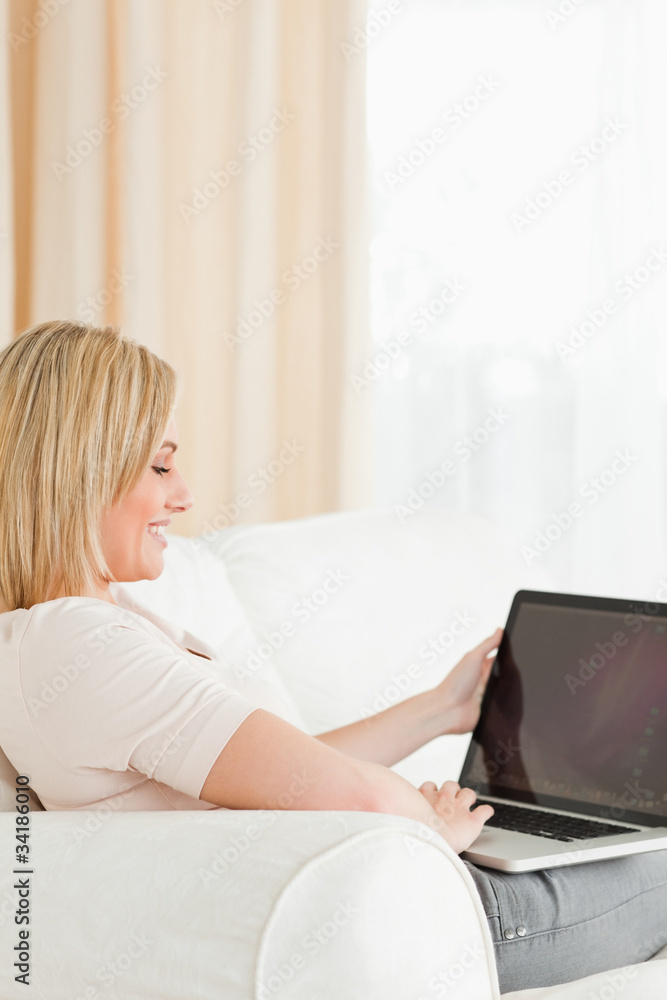 Portrait of a blonde woman using a notebook Portrait of a blonde woman using a notebook