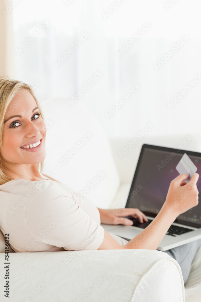 Portrait of a woman paying her bills online Portrait of a woman paying her bills online