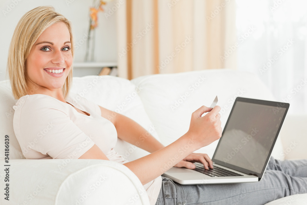 Cute woman paying her bills online Cute woman paying her bills online