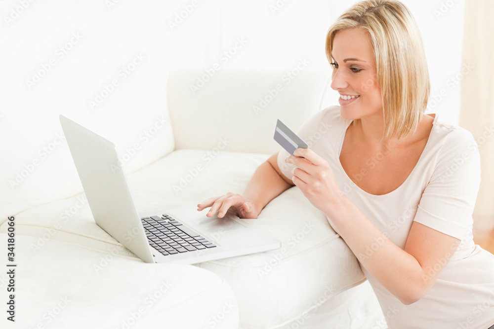 Cute woman booking her holidays online Cute woman booking her holidays online