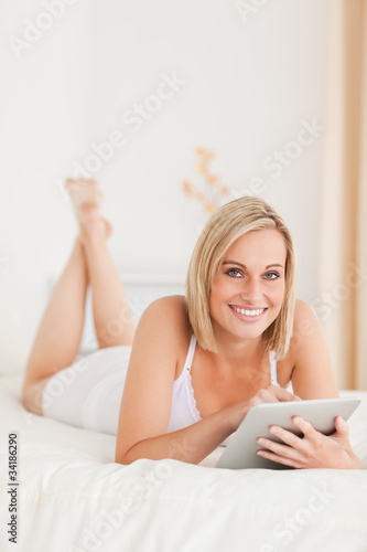 Free Download Portrait of a beautiful woman using a tablet computer - GFXLoad