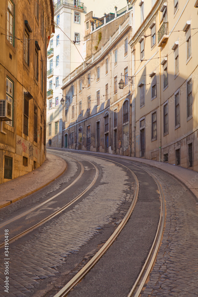Obraz premium Street with tramway rails in Lisbon, Portugal
