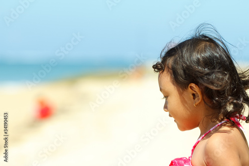 Cute asian little girl on the beach