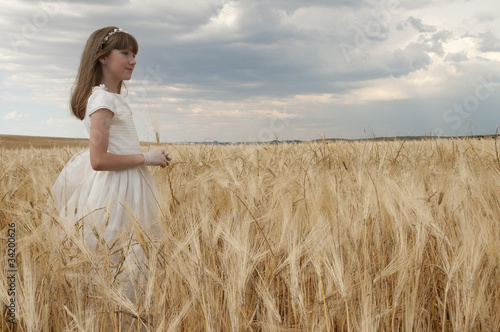 girl wearing first communion dress