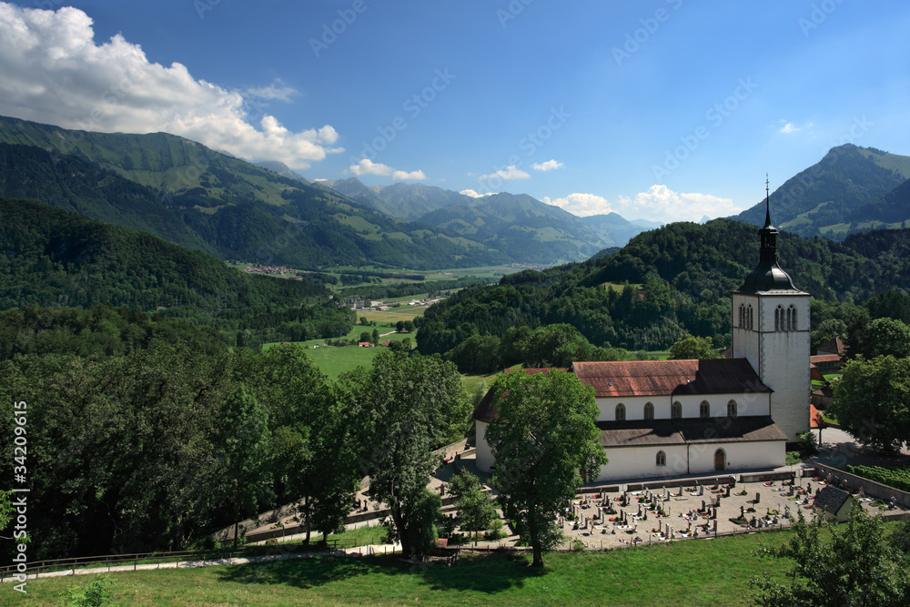 Church and mountains of Gruyeres Switzerland