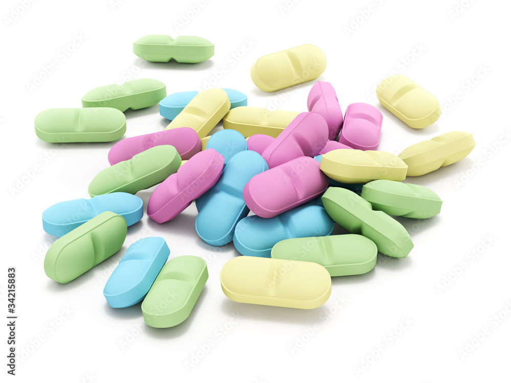 Many colored pills on white