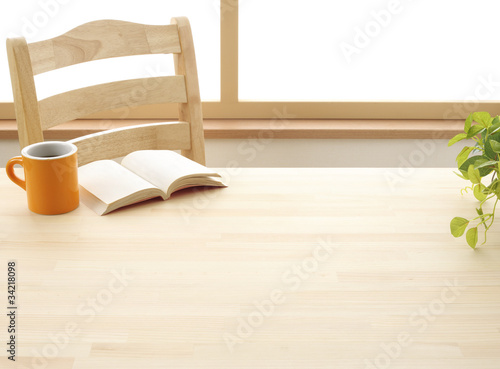 Cup book and plant on wooden table