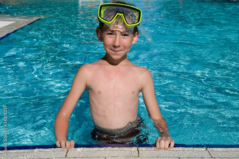 cute boy in a swimming pool