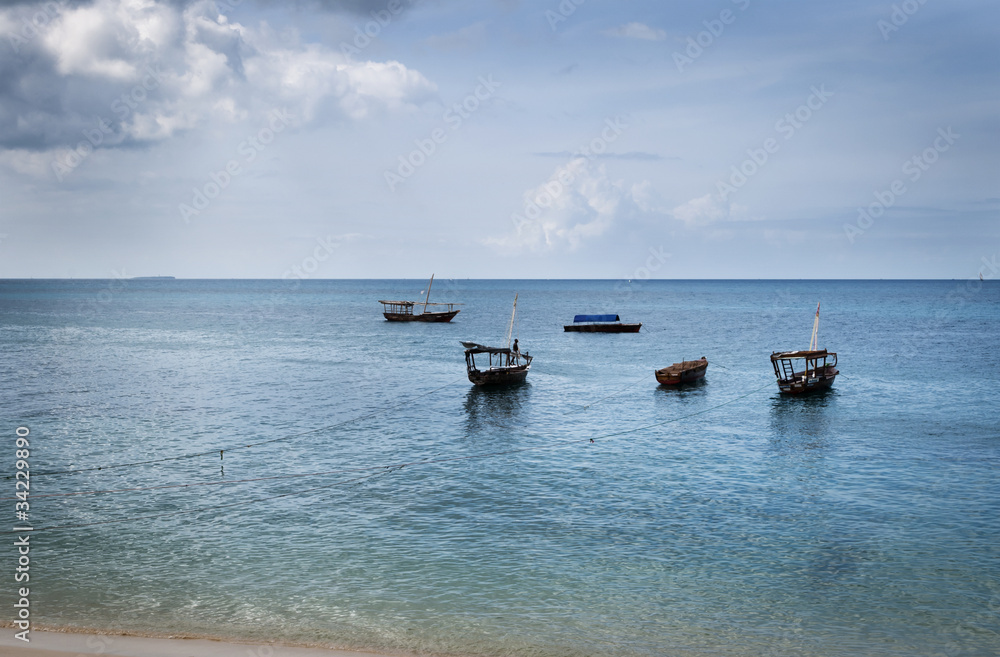 Fishing Dhows off the coast of Stonetown, Zanzibar Fishing Dhows off the coast of Stonetown, Zanzibar
