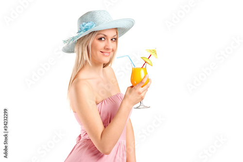 Attractive blond woman drinking a cocktail