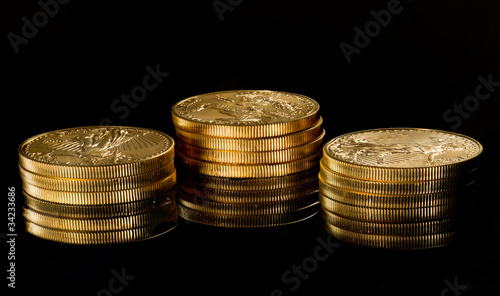 Macro image of gold eagle coin on stack photo